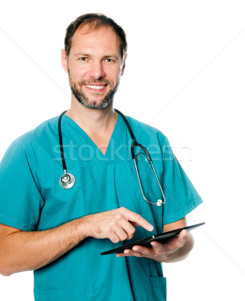 врач рабочих таблетка улыбаясь изолированный Сток-фото © GekaSkr