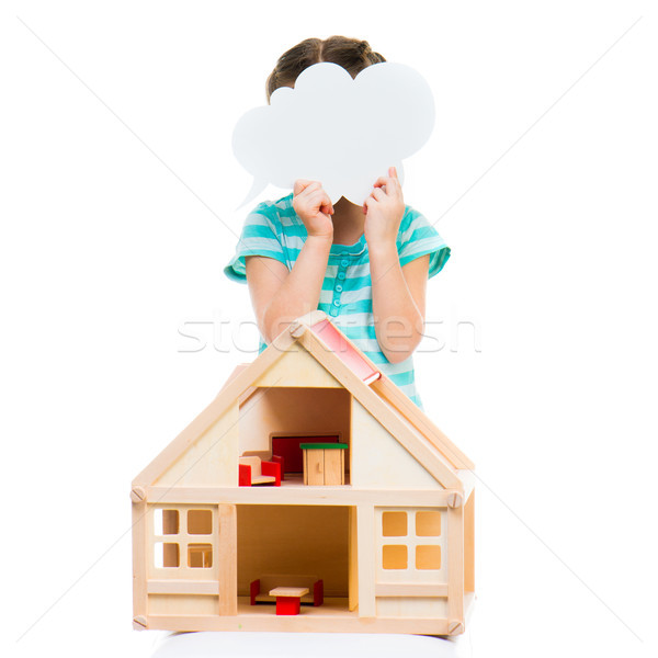 Stock photo: girl with a toy house