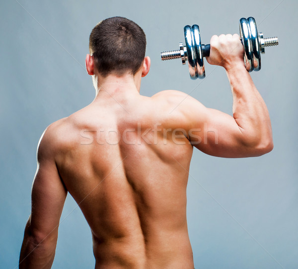 Musculaire homme Retour séduisant athlétique haltères [[stock_photo]] © GekaSkr