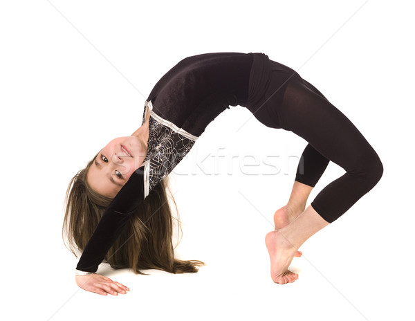 Stock photo: Young girl doing gymnastics