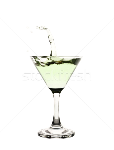Green liquid splashing in a martini glass. Stock photo © gemenacom