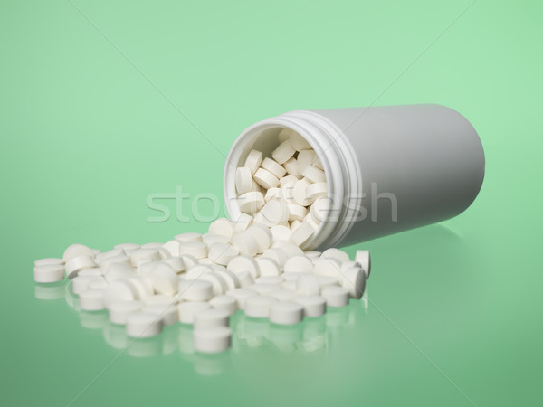 Can of pills toward green background Stock photo © gemenacom