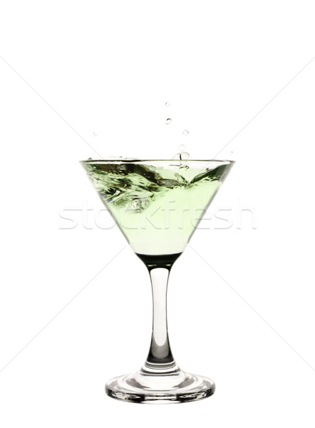 Green liquid splashing in a martini glass. Stock photo © gemenacom