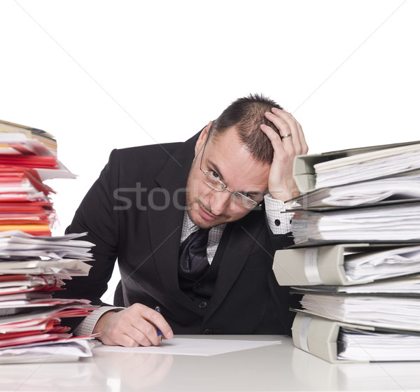 Stock photo: Hard working man in an office