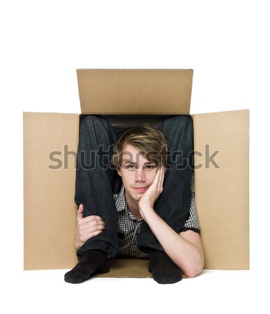 Acrobat inside of a cardboard box. Stock photo © gemenacom