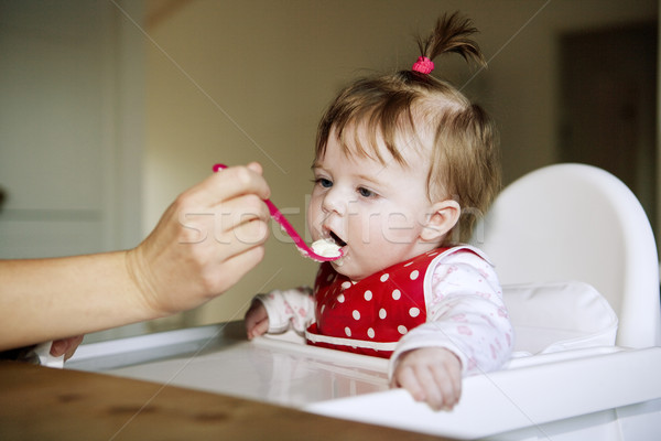 Baby Girl eating Stock photo © gemenacom