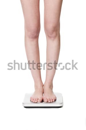 Standing on a wightscale Stock photo © gemenacom