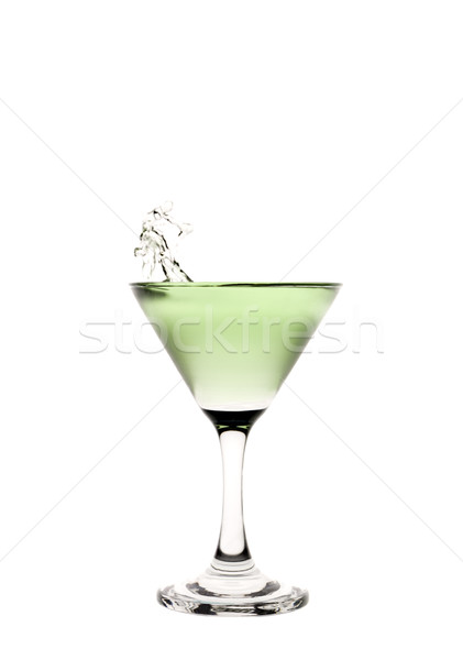 Green liquid splashing in a martini glass. Stock photo © gemenacom