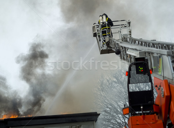 Pompier travail haut échelle eau feu [[stock_photo]] © gemenacom