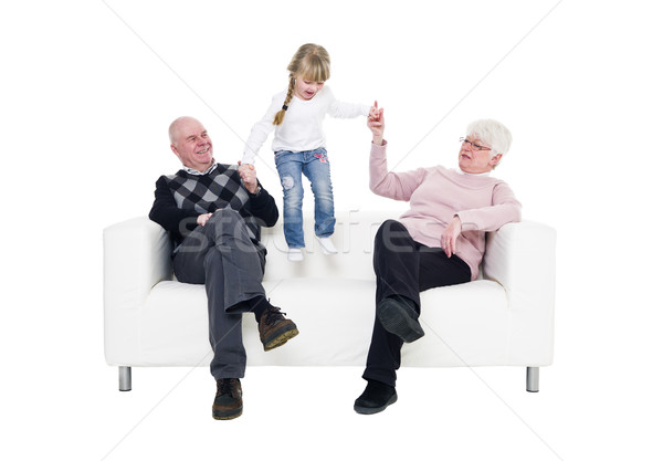Kleines Mädchen Großeltern Sofa isoliert weiß Familie Stock foto © gemenacom
