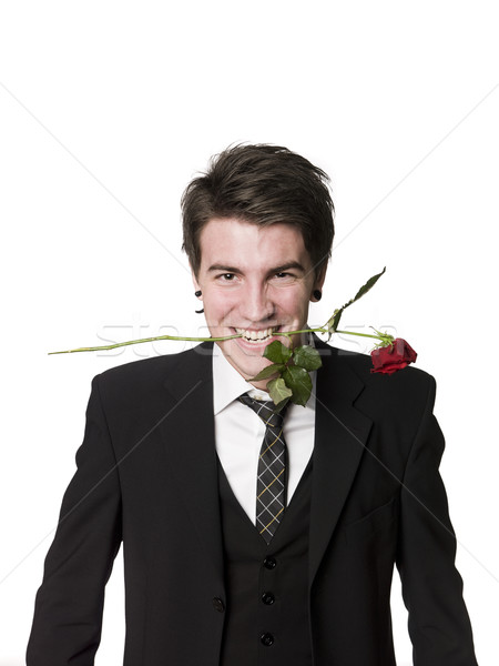 Man with a rose in his mouth Stock photo © gemenacom