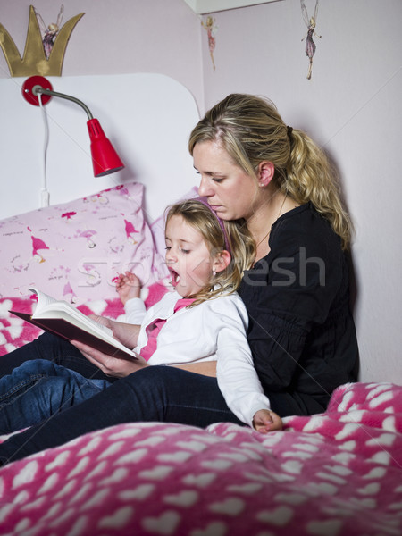 Mother tells a story to her daughter Stock photo © gemenacom