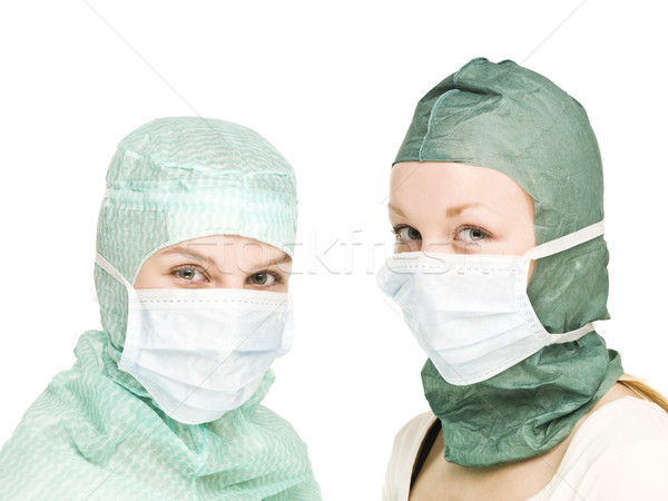 Meisjes chirurgisch maskers twee geïsoleerd witte Stockfoto © gemenacom