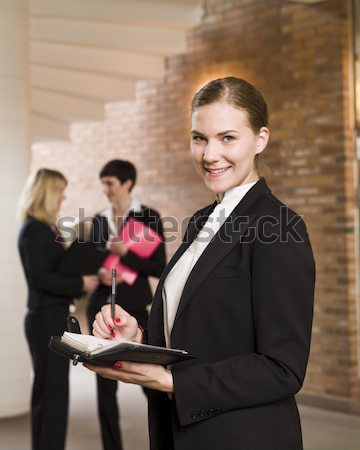 Businesswoman in front of her team Stock photo © gemenacom