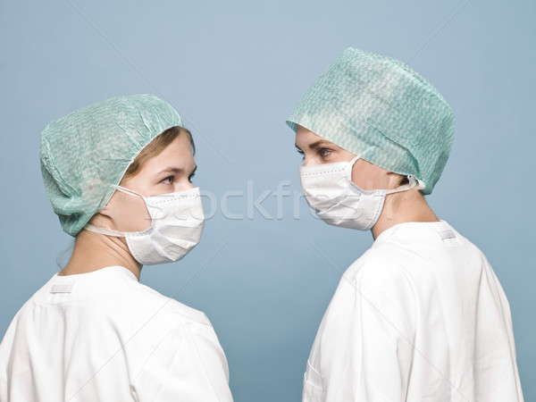 Two nurses with sugical masks Stock photo © gemenacom