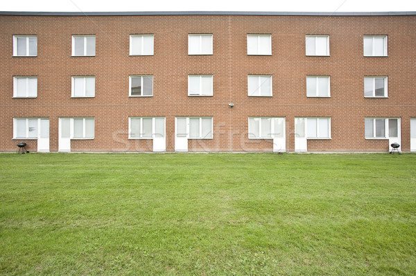 Brick wall buildings on a cloudy day Stock photo © gemenacom