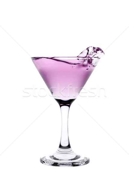 Pink liquid splashing in a martini glass isolated on white backg Stock photo © gemenacom