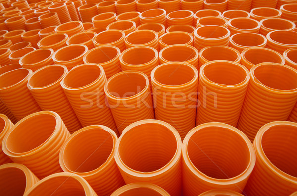 Large Group of Orange Industrial Plastic Pipes Full Frame Stock photo © gemenacom