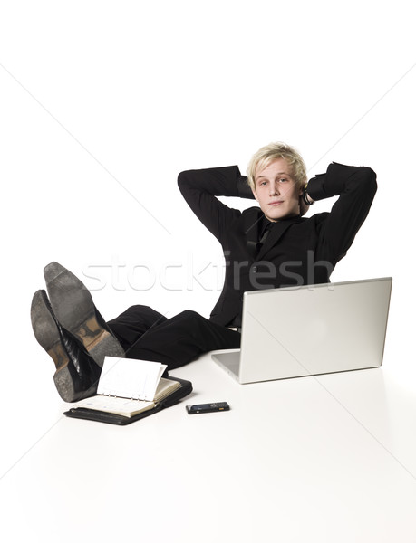 Relaxed boy infront of a desk Stock photo © gemenacom