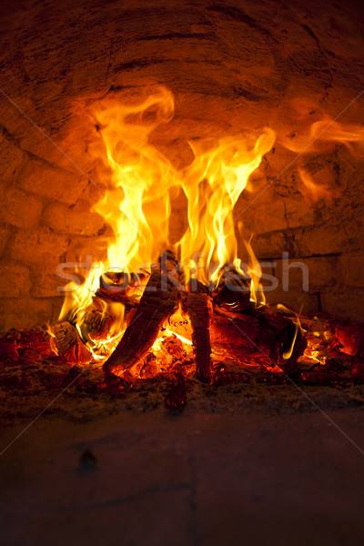 Máglya lángoló téglafal éjszaka citromsárga kandalló Stock fotó © gemenacom