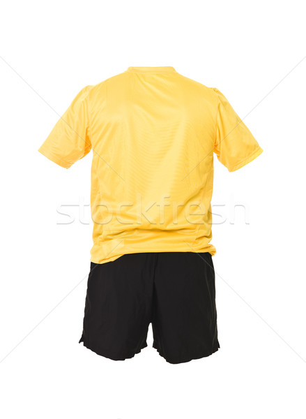 Geel voetbal shirt zwarte shorts geïsoleerd Stockfoto © gemenacom