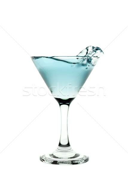 Green liquid splashing in a martini glass isolated on white back Stock photo © gemenacom