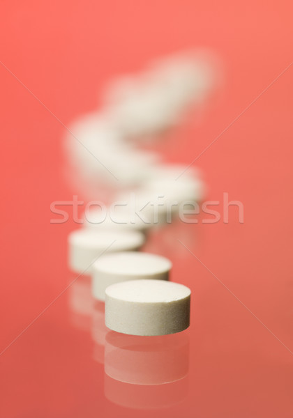 Pills toward red background Stock photo © gemenacom