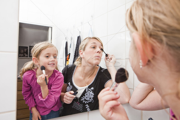Mother and Daughter put on make-up Stock photo © gemenacom
