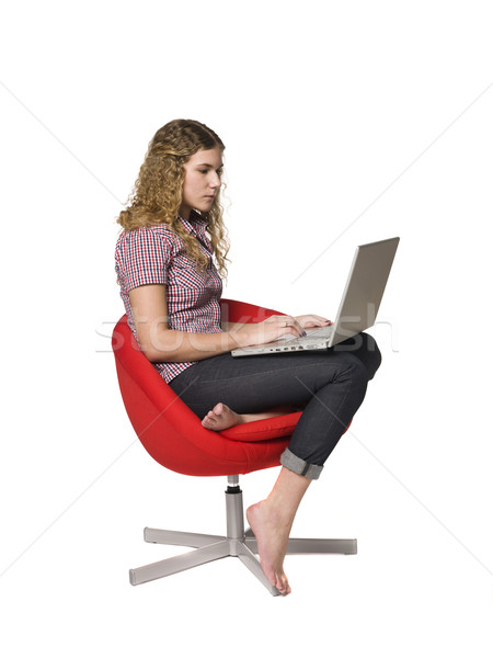 Girl in a armchair with a computer Stock photo © gemenacom