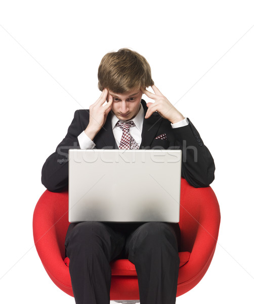 A depressed man with a laptop Stock photo © gemenacom