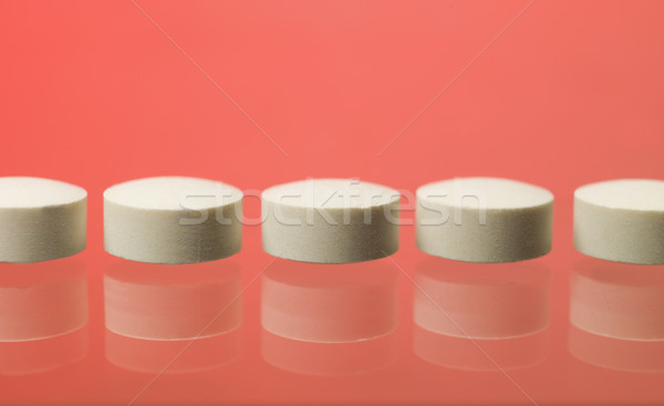 Pills toward red background Stock photo © gemenacom