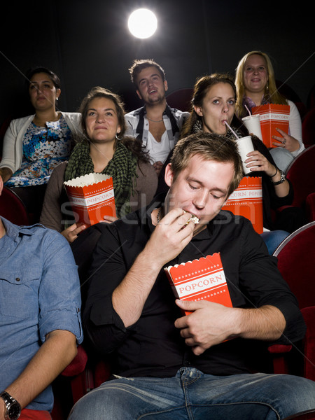 Man at the cinema with popcorn Stock photo © gemenacom