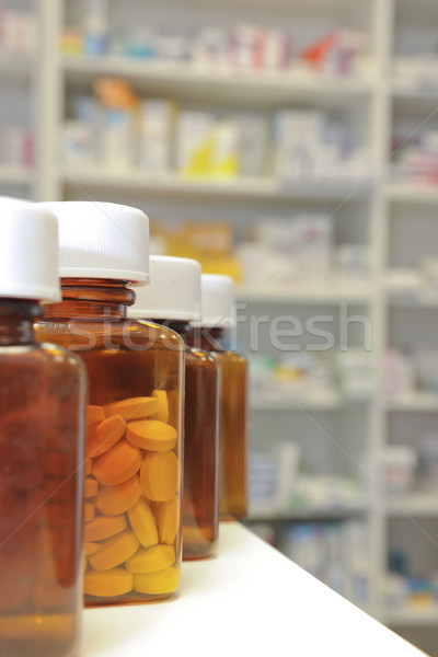 row of pill bottles Stock photo © gemphoto