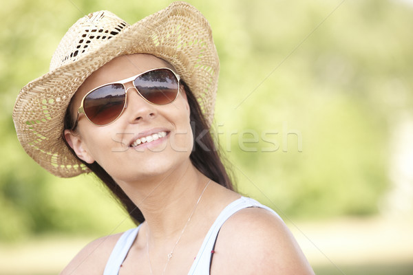 girl wearing hat and sunglasses Stock photo © gemphoto