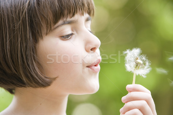 girl blowing a dandelion Stock photo © gemphoto