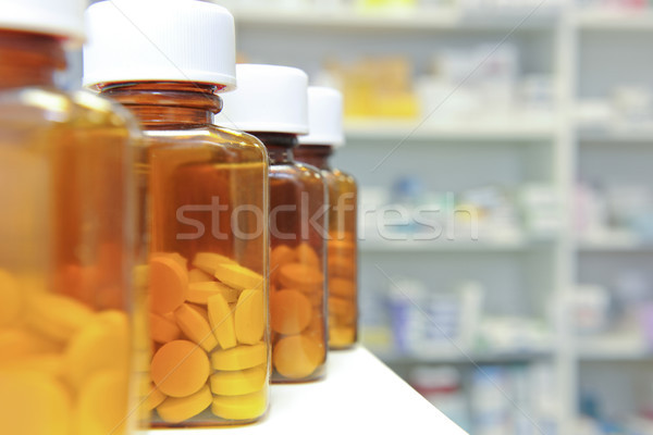 row of pill bottles Stock photo © gemphoto