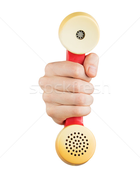 Kéz tart piros telefonkagyló izolált fehér Stock fotó © GeniusKp