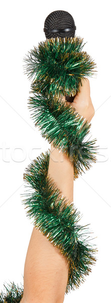 Female hand with green garland holding a microphone Stock photo © GeniusKp