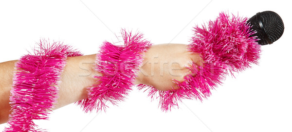 Female hand with pink garland holding a microphone Stock photo © GeniusKp