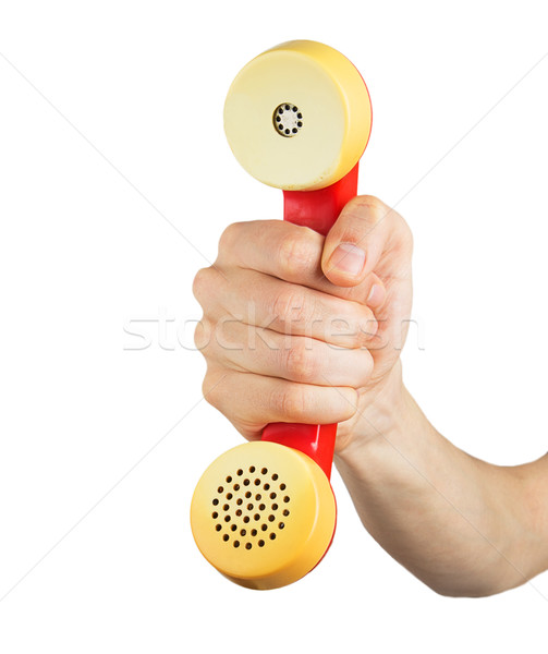 Hand holding red telephone receiver Stock photo © GeniusKp