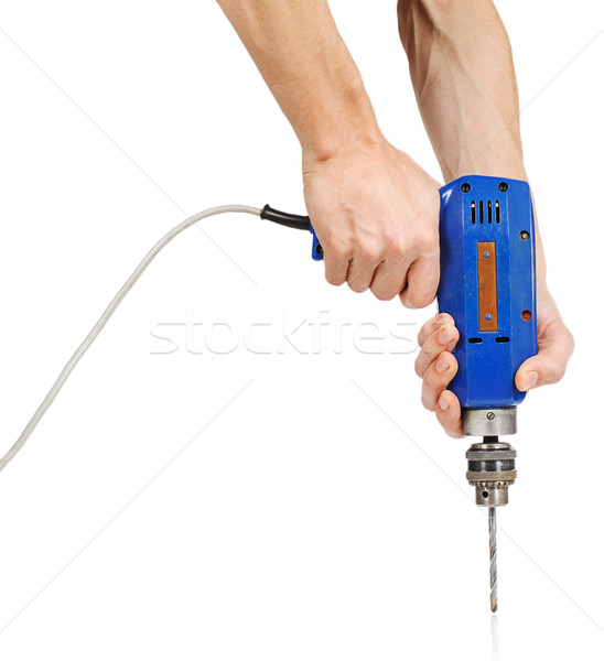 Man's hands holds a blue drill Stock photo © GeniusKp