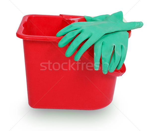 Stock photo: Red plastic bucket and green rubber glove
