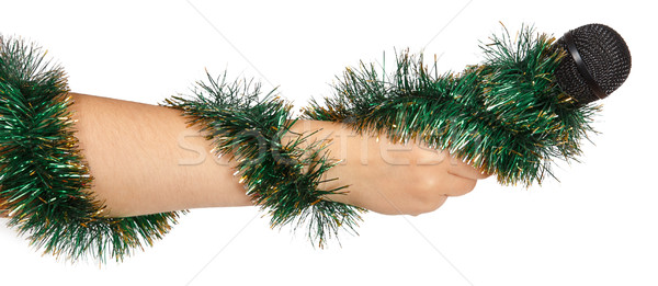 Female hand with green garland holding a microphone Stock photo © GeniusKp