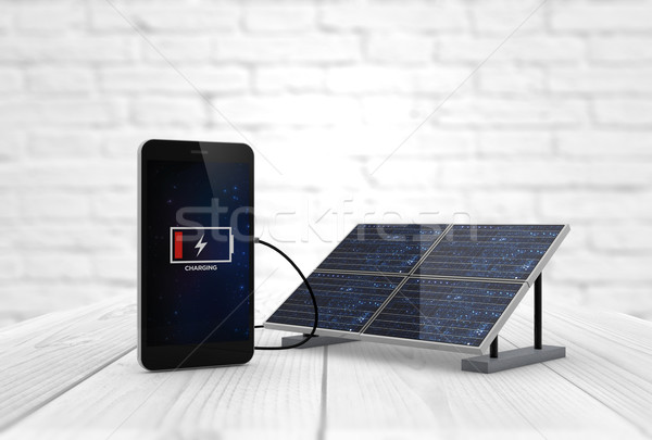 phone charging solar pannel Stock photo © georgejmclittle