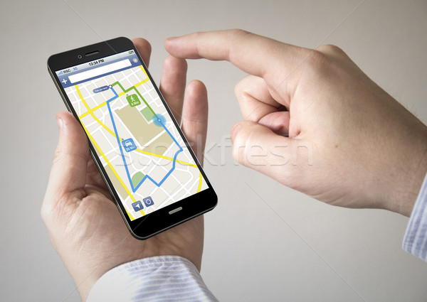 Ekran dotykowy smartphone online aplikacja człowiek Zdjęcia stock © georgejmclittle