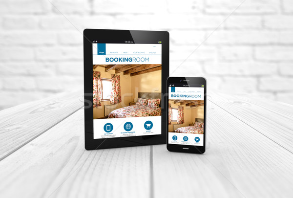 booking web on tablet and smart phone Stock photo © georgejmclittle