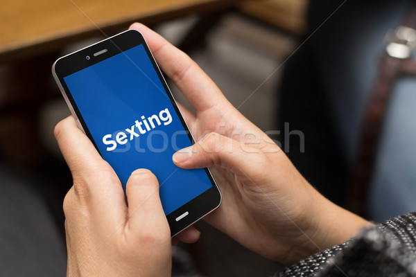 street girl sexting Stock photo © georgejmclittle