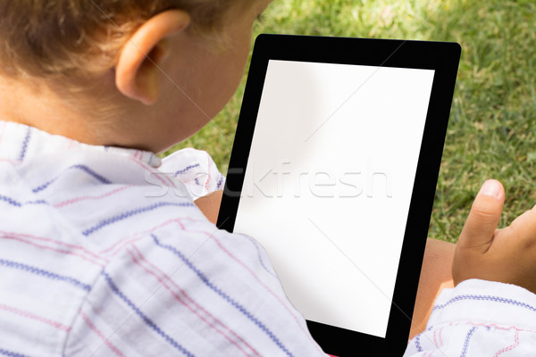 Boy with tablet Stock photo © georgejmclittle