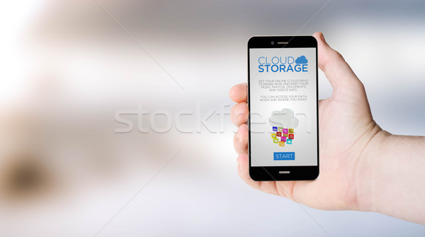 Mobiele telefoon wolk opslag online hand drive Stockfoto © georgejmclittle