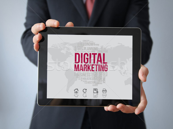Stock photo: businessman with digital marketing on a tablet
